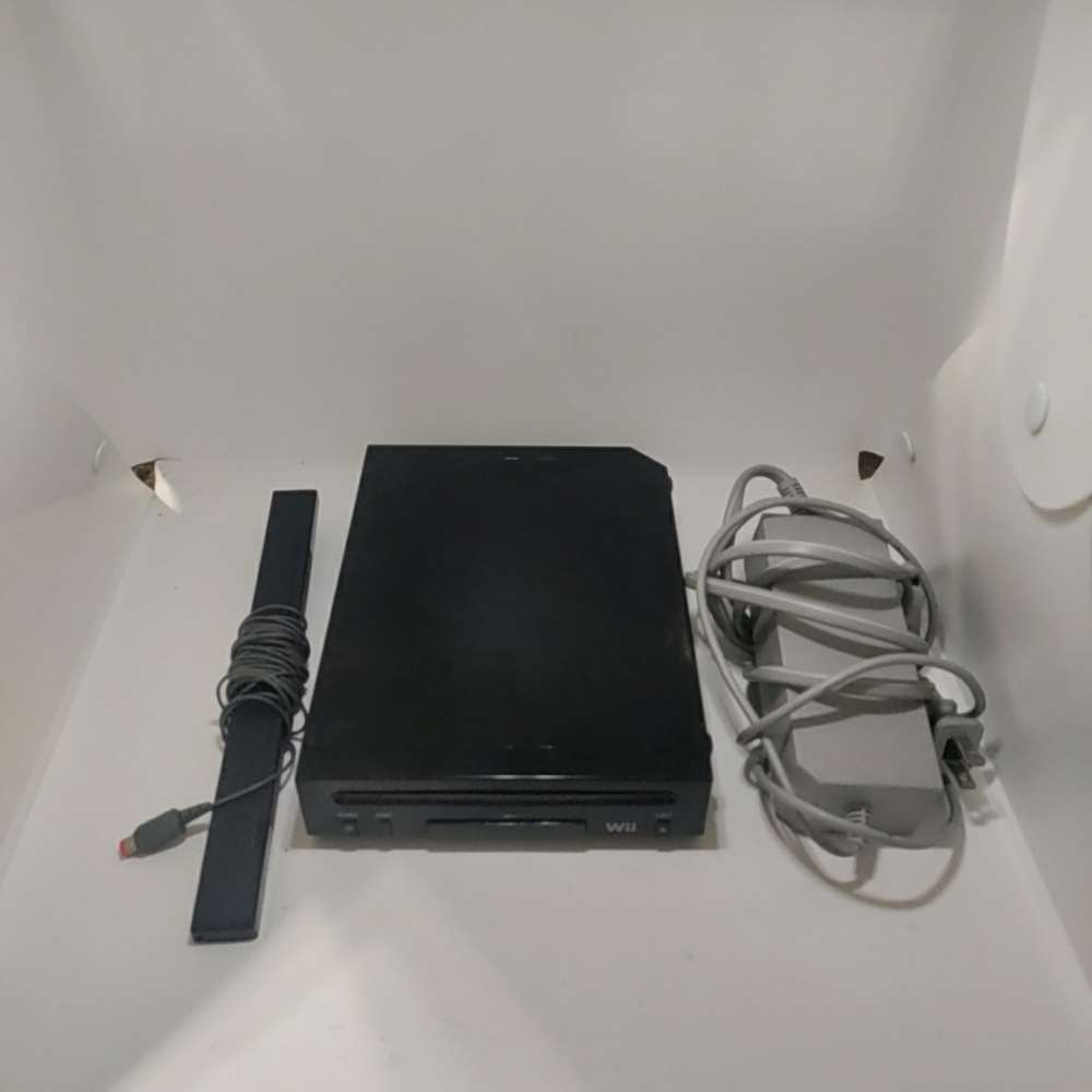 Nintendo Wii Black Console with AV cord, plug and bar used.. Tested the Nintendo